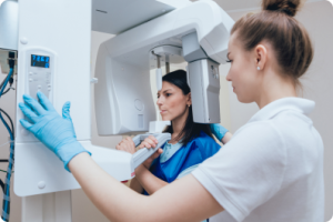 hygienist taking a dental xray of a patient