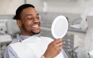 man smiling in dental chair