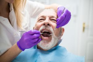 older man getting a dental exam