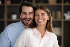 man and woman smiling